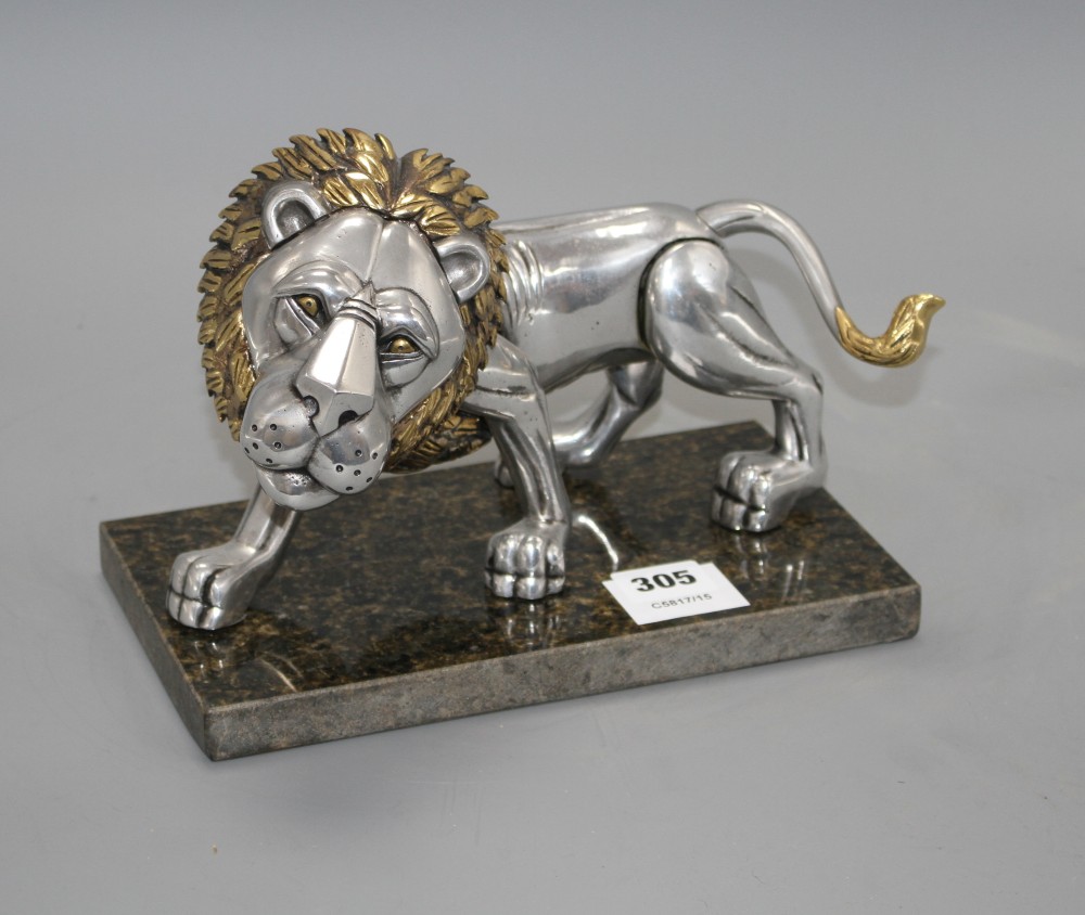 A Frank Meisler parcel gilt pewter model of a lion, no.83/480, on marble stand, length 27cm